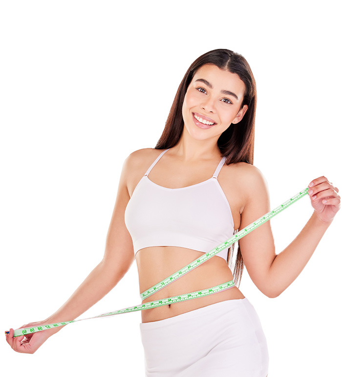 Weight loss success - woman measuring waist